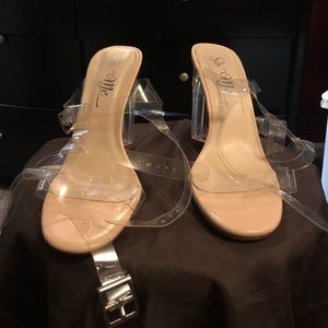 Clear block heel with clear straps.